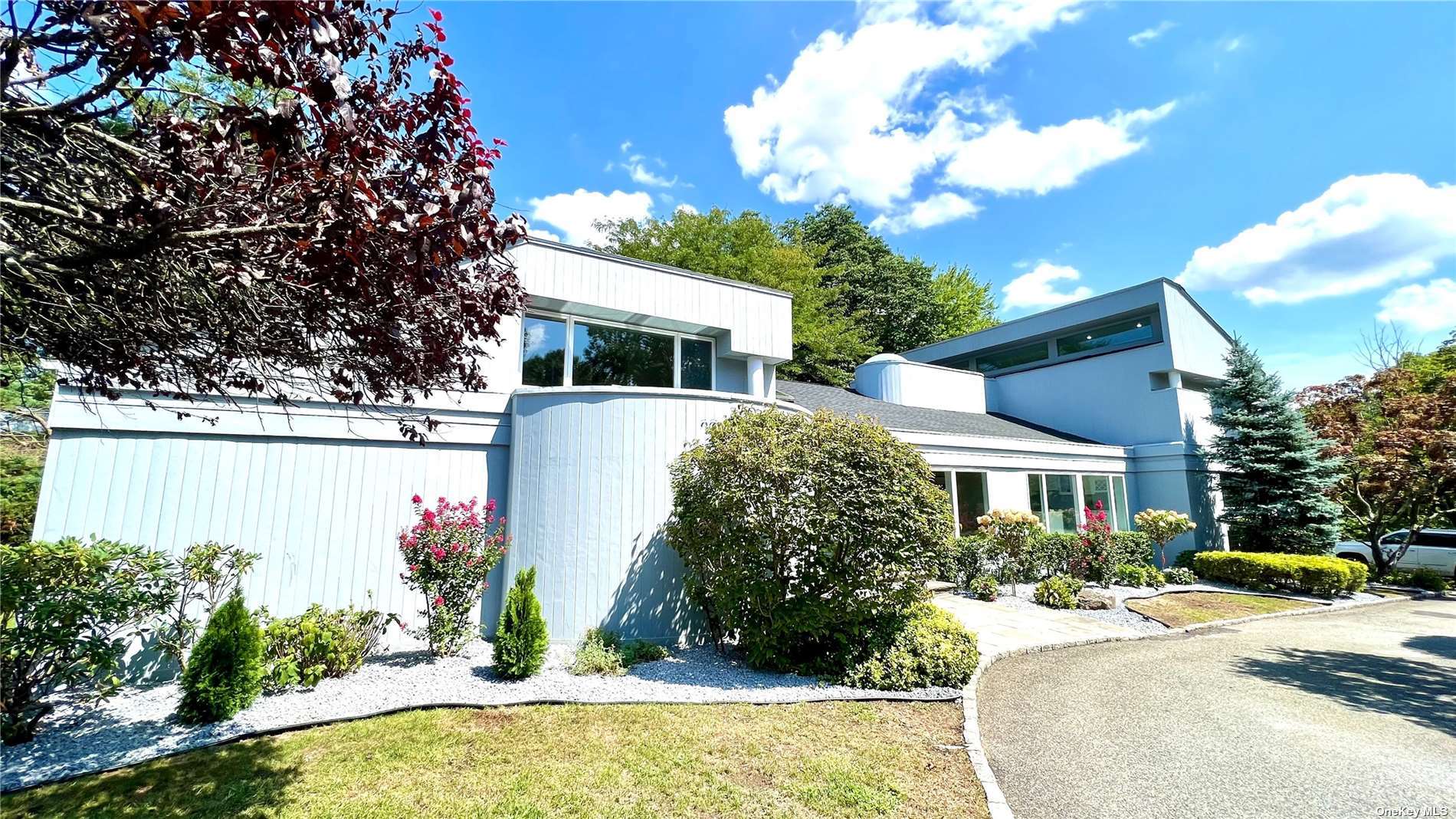 24 North Flamingo Road East Hills, NY 11576 - Photo 1 of 1 a front view of a house with a yard