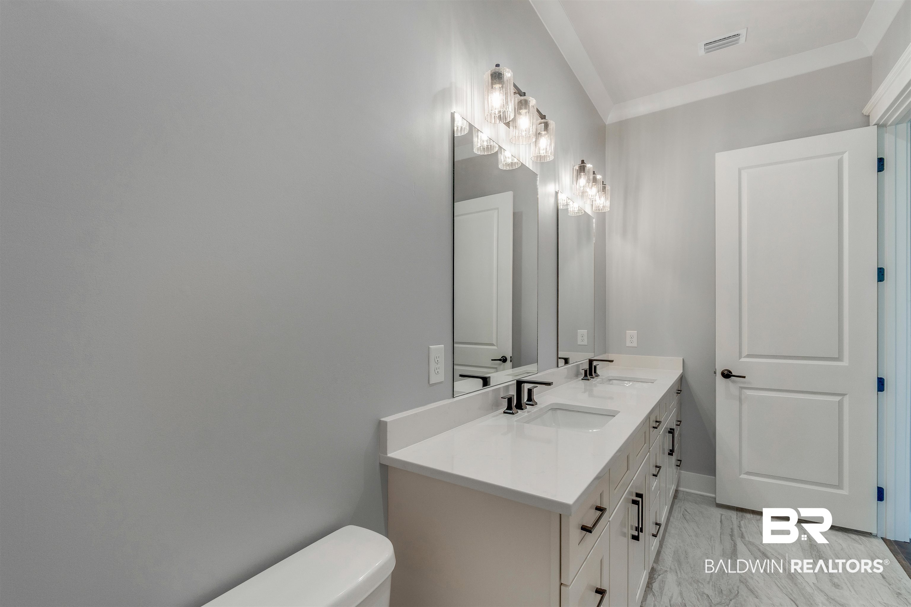 10985 Atrium Avenue Fairhope, AL 36532 - Photo 36 of 58 Full bathroom with double vanity and ornamental molding