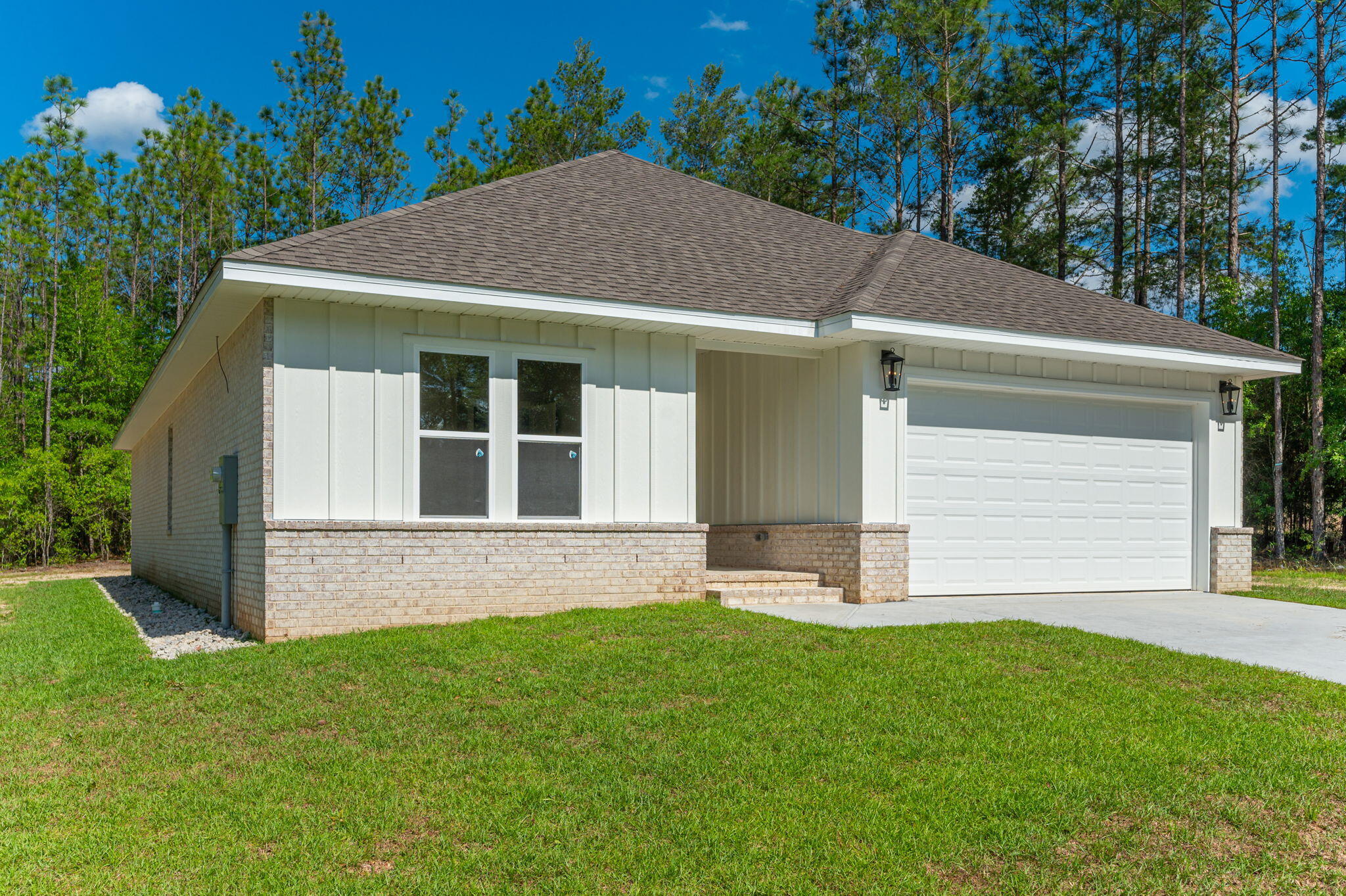6041 Sand Hill Road Crestview, FL 32539 - Photo 3 of 37 a view of house with backyard and garden