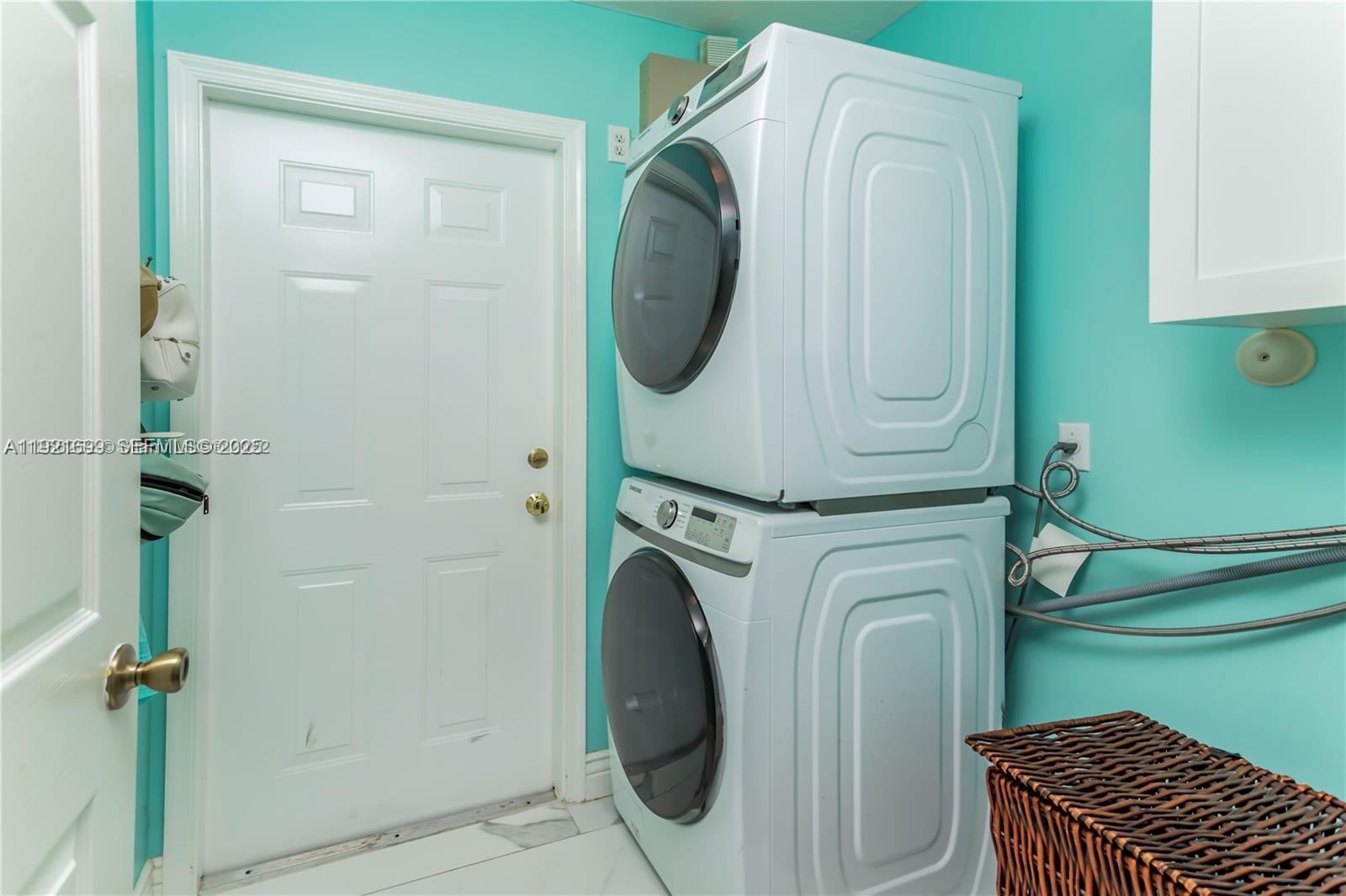 17996 North 42nd Road North Loxahatchee, FL 33470 - Photo 24 of 34 a utility room with dryer and washer