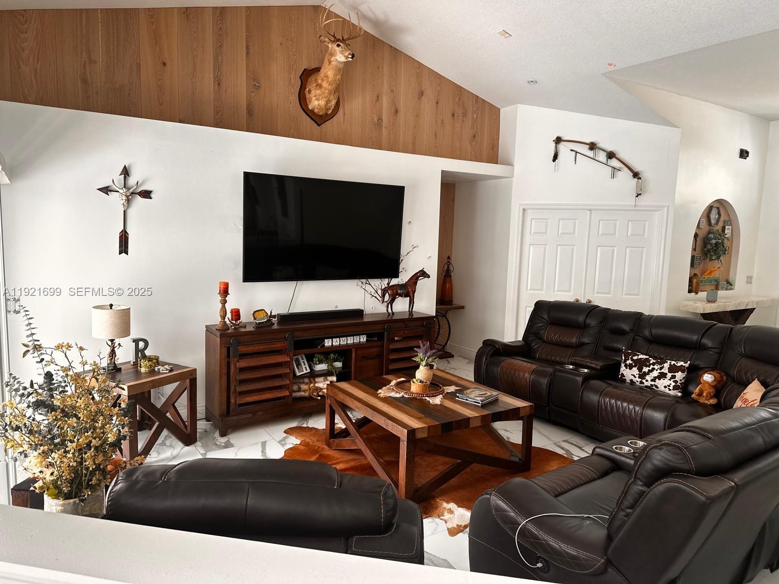17996 North 42nd Road North Loxahatchee, FL 33470 - Photo 33 of 34 a living room with furniture and a flat screen tv