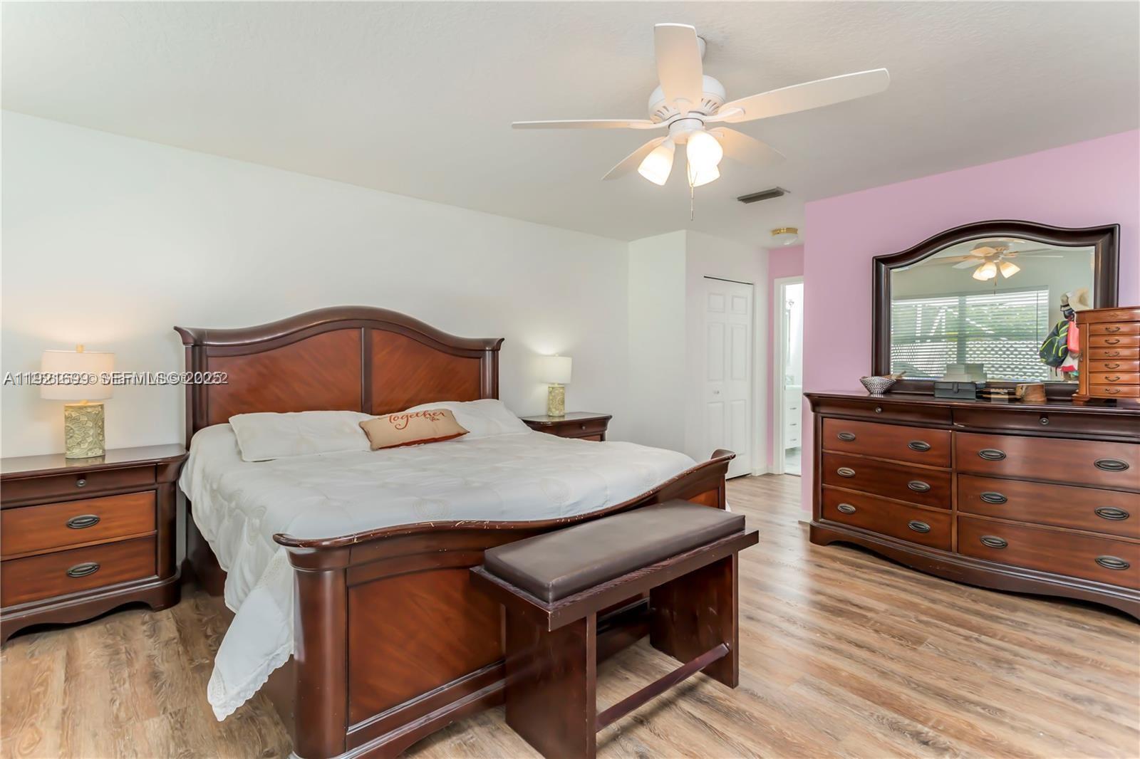 17996 North 42nd Road North Loxahatchee, FL 33470 - Photo 10 of 34 a bedroom with a bed and a dresser