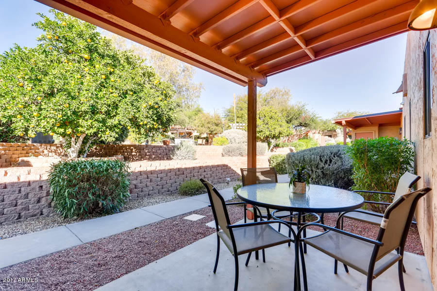 540 South West Road, Unit 26 Wickenburg, AZ 85390 - Photo 7 of 14 a view of an outdoor space with table and chair