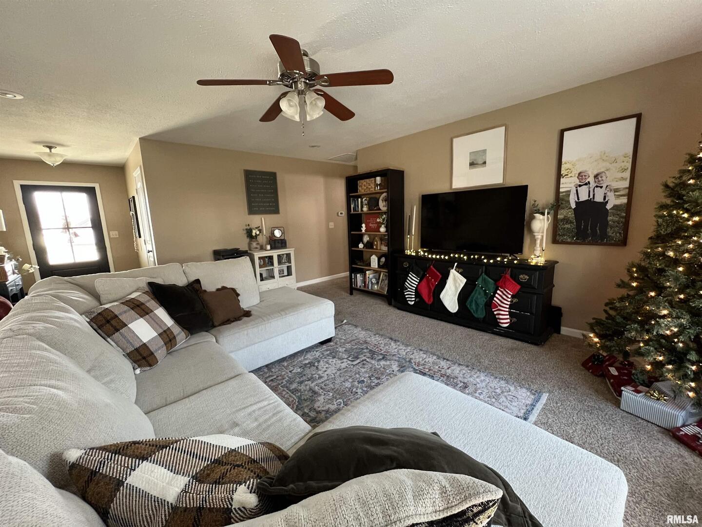 413 West Beacon Court Mount Vernon, IL 62864 - Photo 19 of 34 a living room with furniture and a flat screen tv