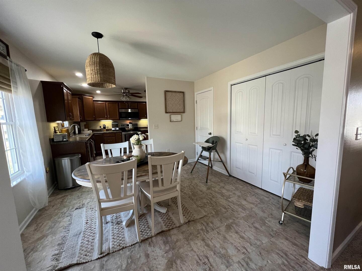 413 West Beacon Court Mount Vernon, IL 62864 - Photo 23 of 34 a dining room with furniture a chandelier and wooden floor