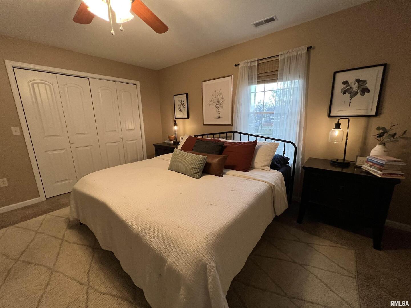 413 West Beacon Court Mount Vernon, IL 62864 - Photo 27 of 34 a bedroom with a bed and a chandelier