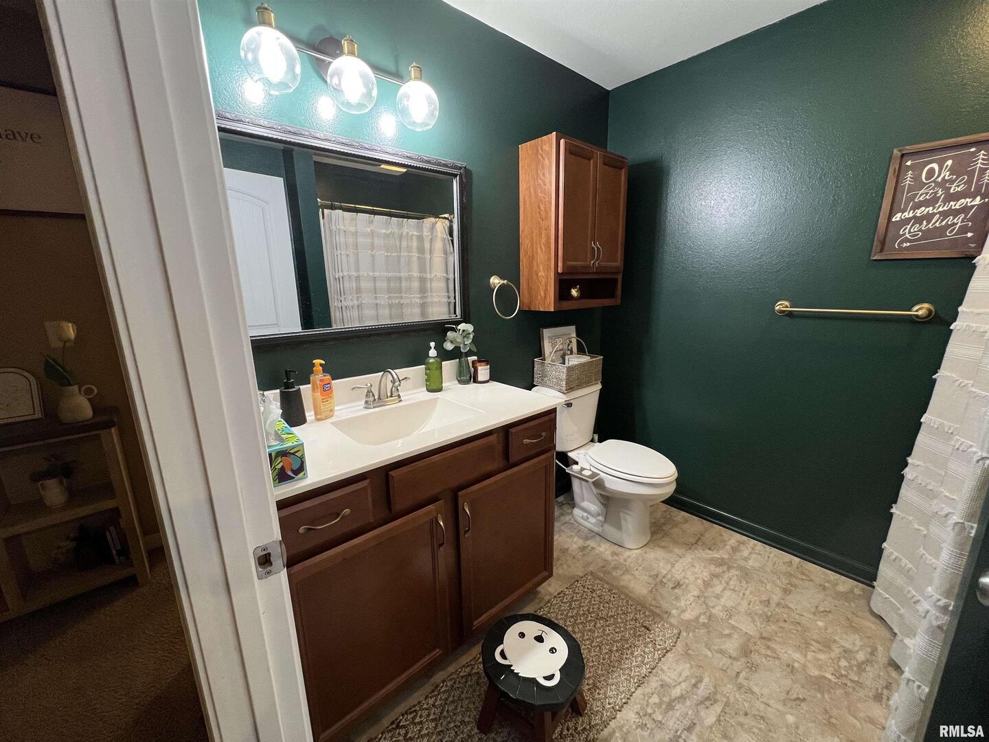 413 West Beacon Court Mount Vernon, IL 62864 - Photo 32 of 34 a bathroom with a sink and a mirror