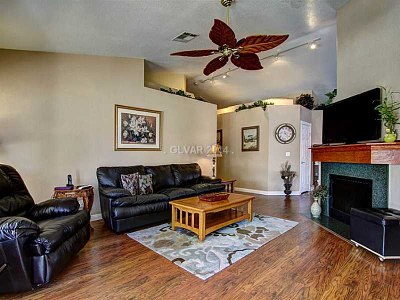 129 Park Ridge Lane Henderson, NV 89002 - Photo 3 of 16 Property Photo. E sided fireplace and open to kitchen