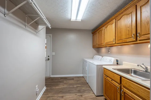 a view of storage and utility room with a sink