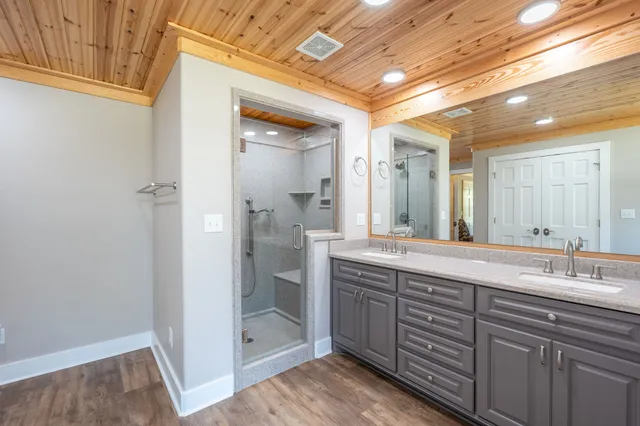 a spacious bathroom with a shower and a sink