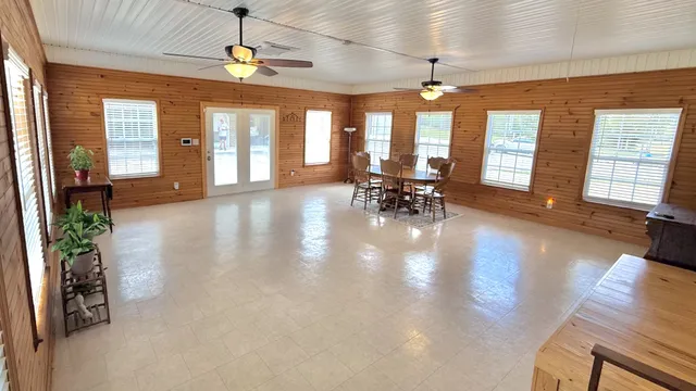 a view of an entryway with wooden floor and windows