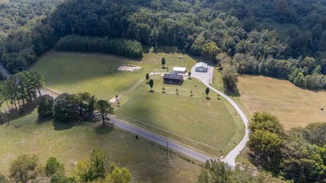 a view of a swimming pool with a yard