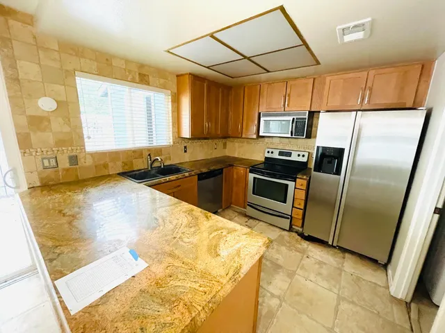 a kitchen with granite countertop a sink and counter space