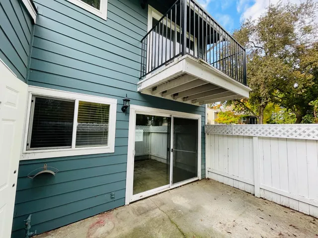 a view of a house with wooden deck