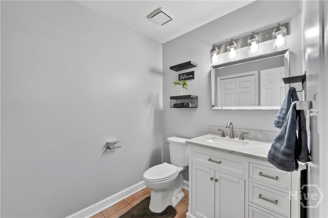 420 Willowpeg Way Rincon, GA 31326 - Photo 23 of 48 half bathroom with linen closet