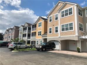 6413 Astor Village Avenue, Unit 212 Orlando, FL 32835 - Photo 1 of 16 a car parked in front of a building