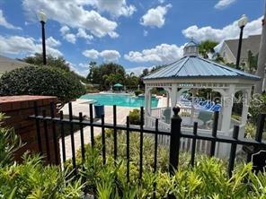 6413 Astor Village Avenue, Unit 212 Orlando, FL 32835 - Photo 16 of 16 a view of a patio