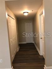 6413 Astor Village Avenue, Unit 212 Orlando, FL 32835 - Photo 4 of 16 a view of an entryway door with wooden floor