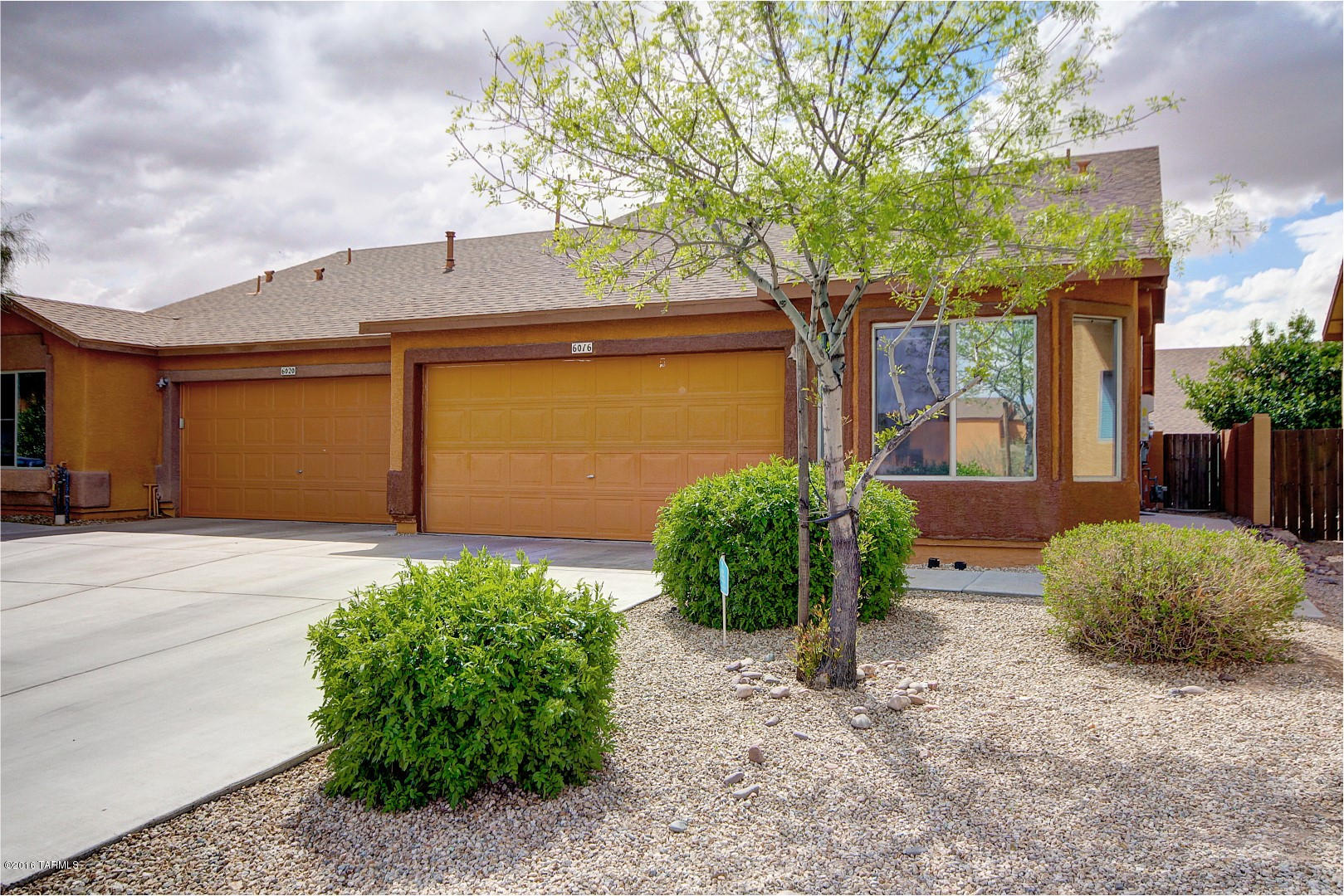 6016 South Avenida Ribero Tucson, AZ 85706 - Photo 1 of 15 a front view of a house with garden