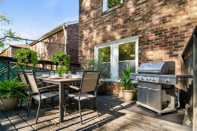 a view of an outdoor space with a table and chairs