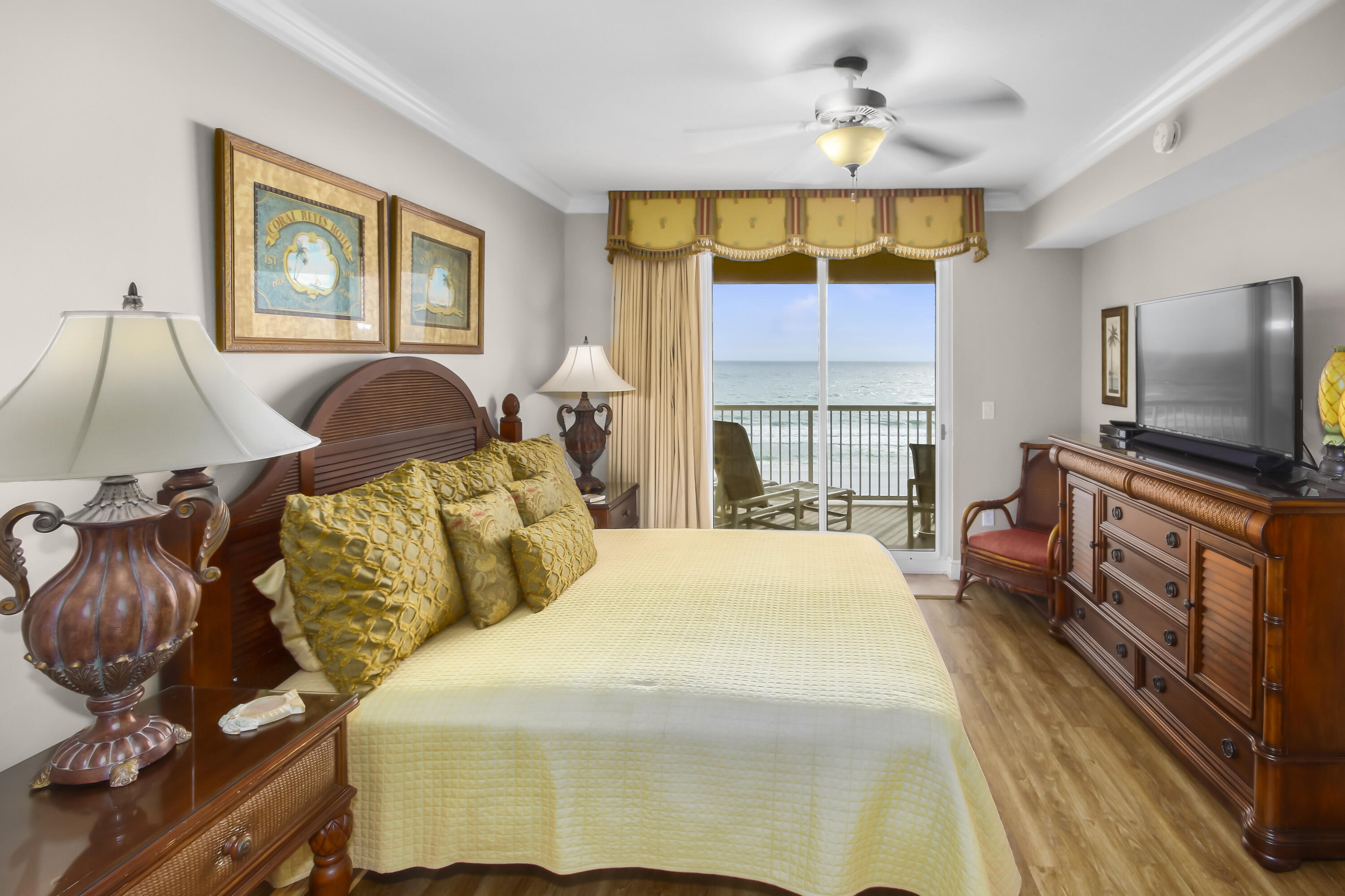 1150 Santa Rosa Boulevard, Unit 502 Fort Walton Beach, FL 32548 - Photo 12 of 43 a bedroom with a bed and glass windows