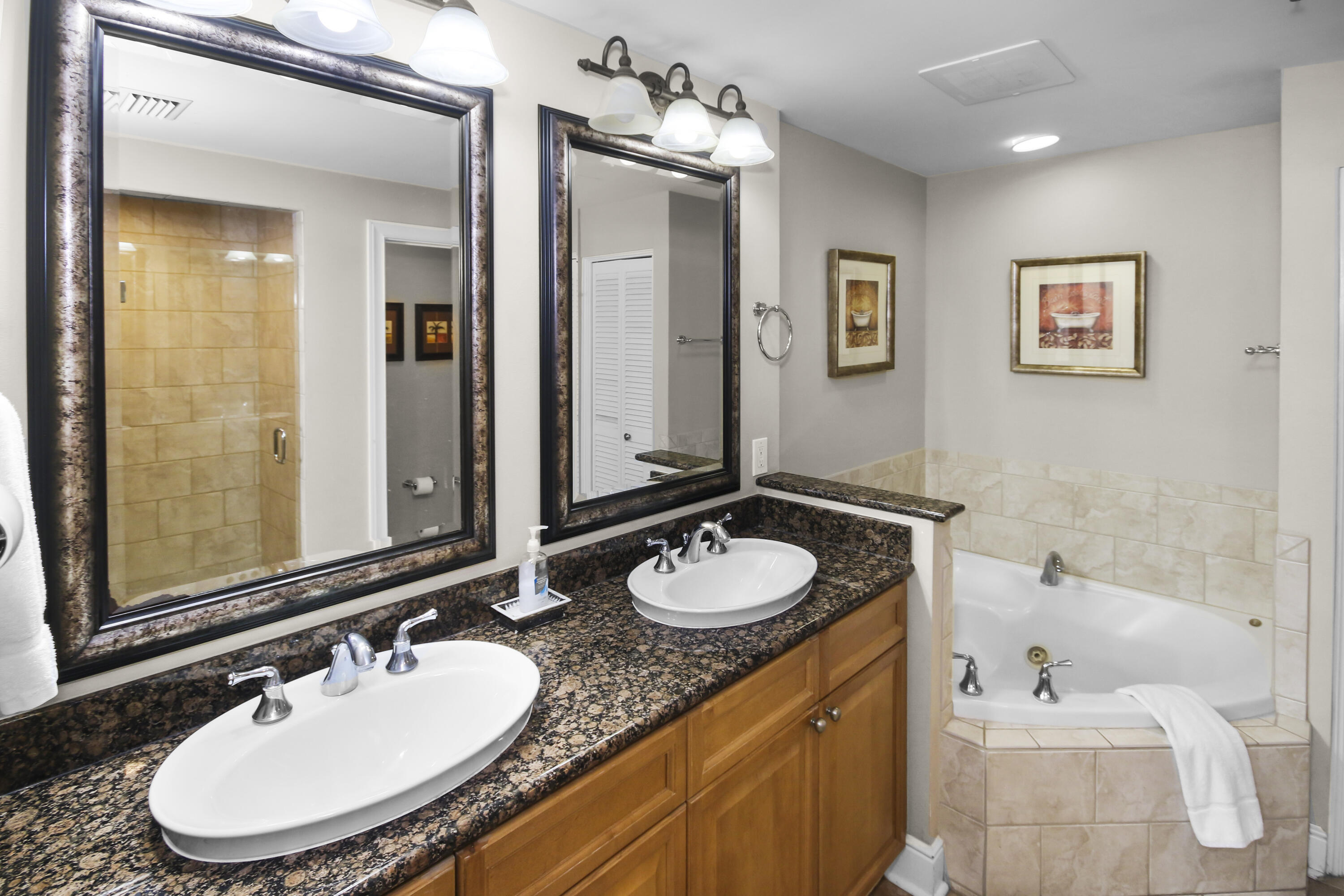 1150 Santa Rosa Boulevard, Unit 502 Fort Walton Beach, FL 32548 - Photo 14 of 43 a bathroom with a granite countertop sink and a mirror