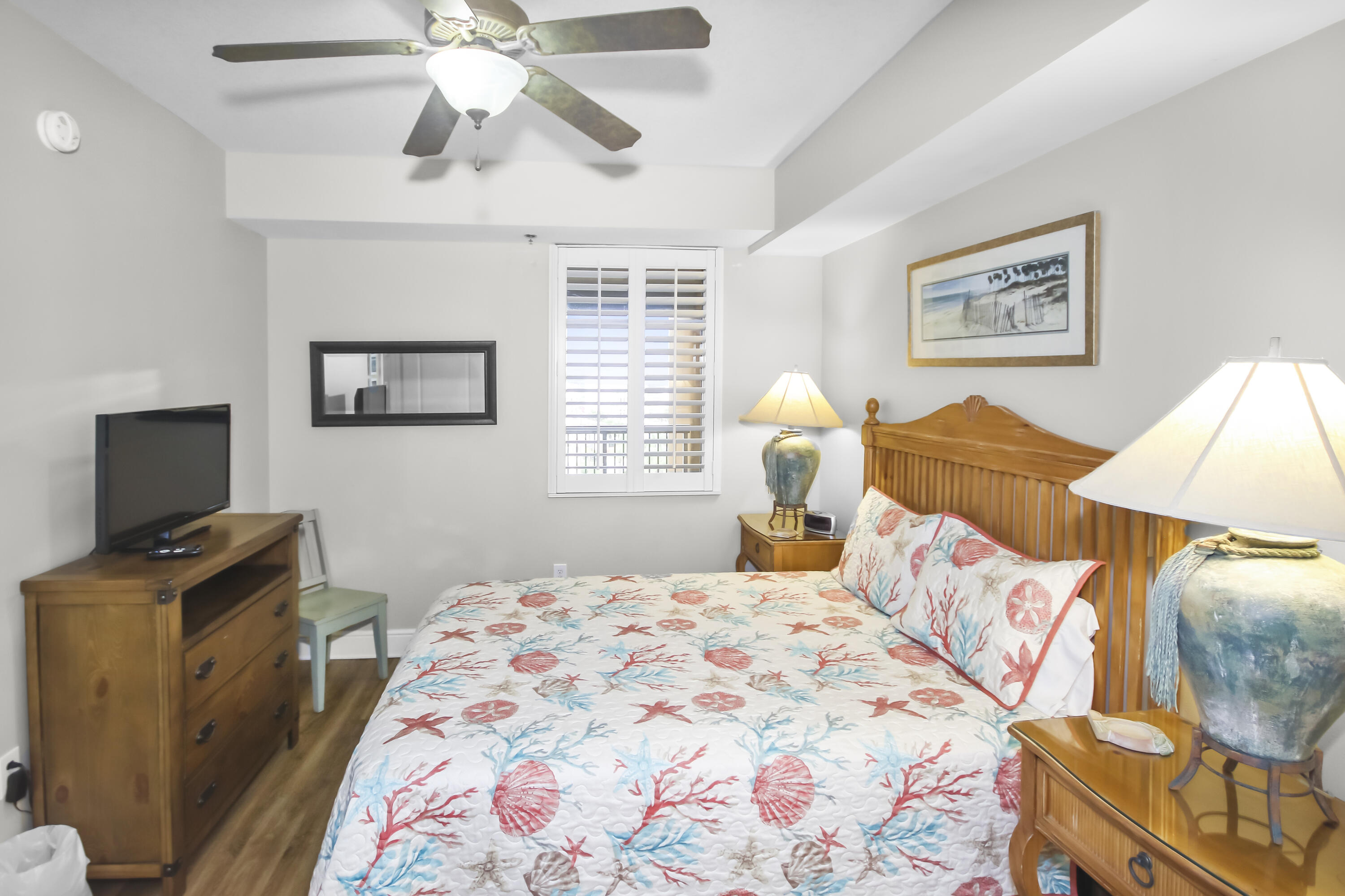 1150 Santa Rosa Boulevard, Unit 502 Fort Walton Beach, FL 32548 - Photo 15 of 43 a bedroom with a bed and a flat screen tv