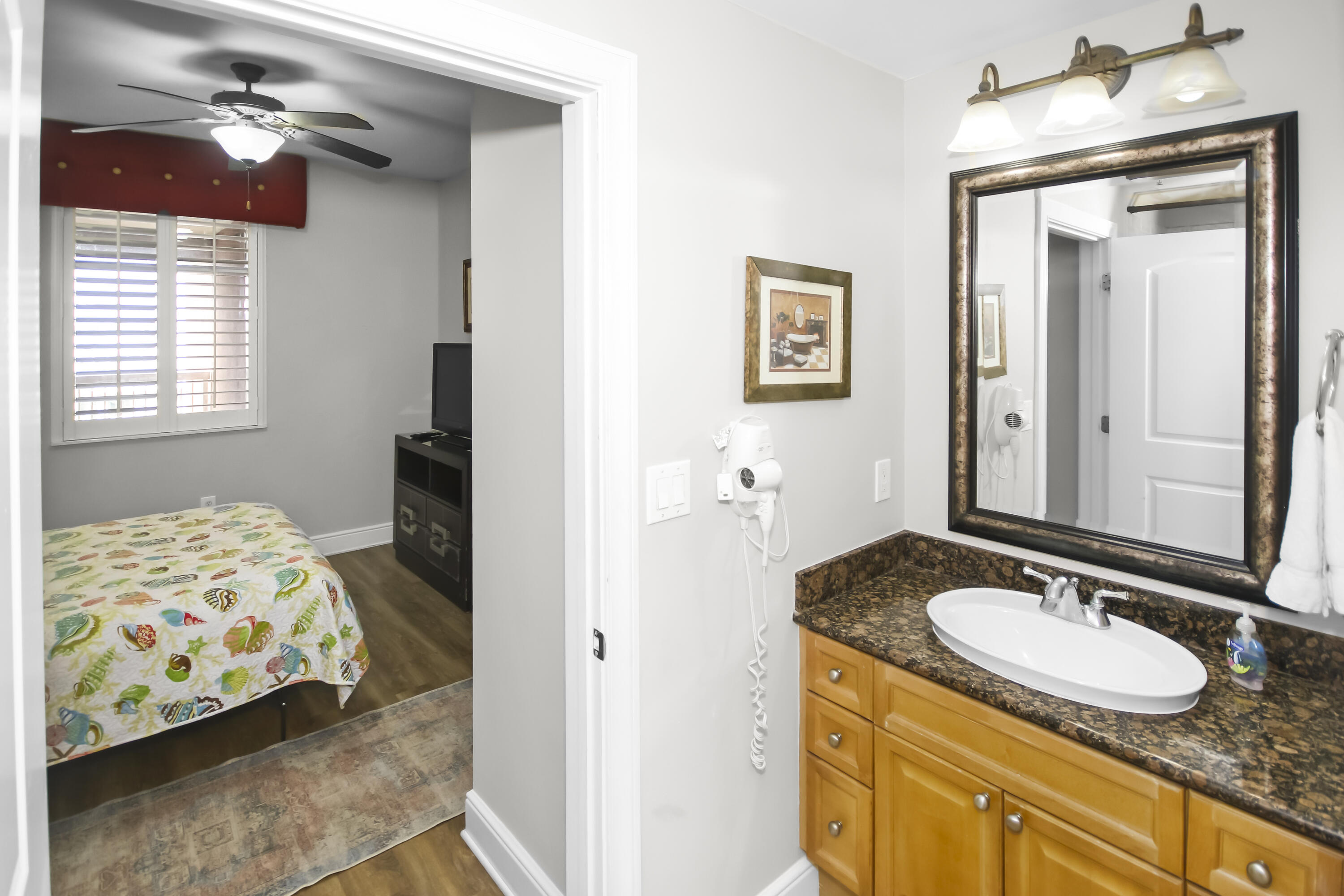 1150 Santa Rosa Boulevard, Unit 502 Fort Walton Beach, FL 32548 - Photo 18 of 43 a bathroom with a sink and a mirror
