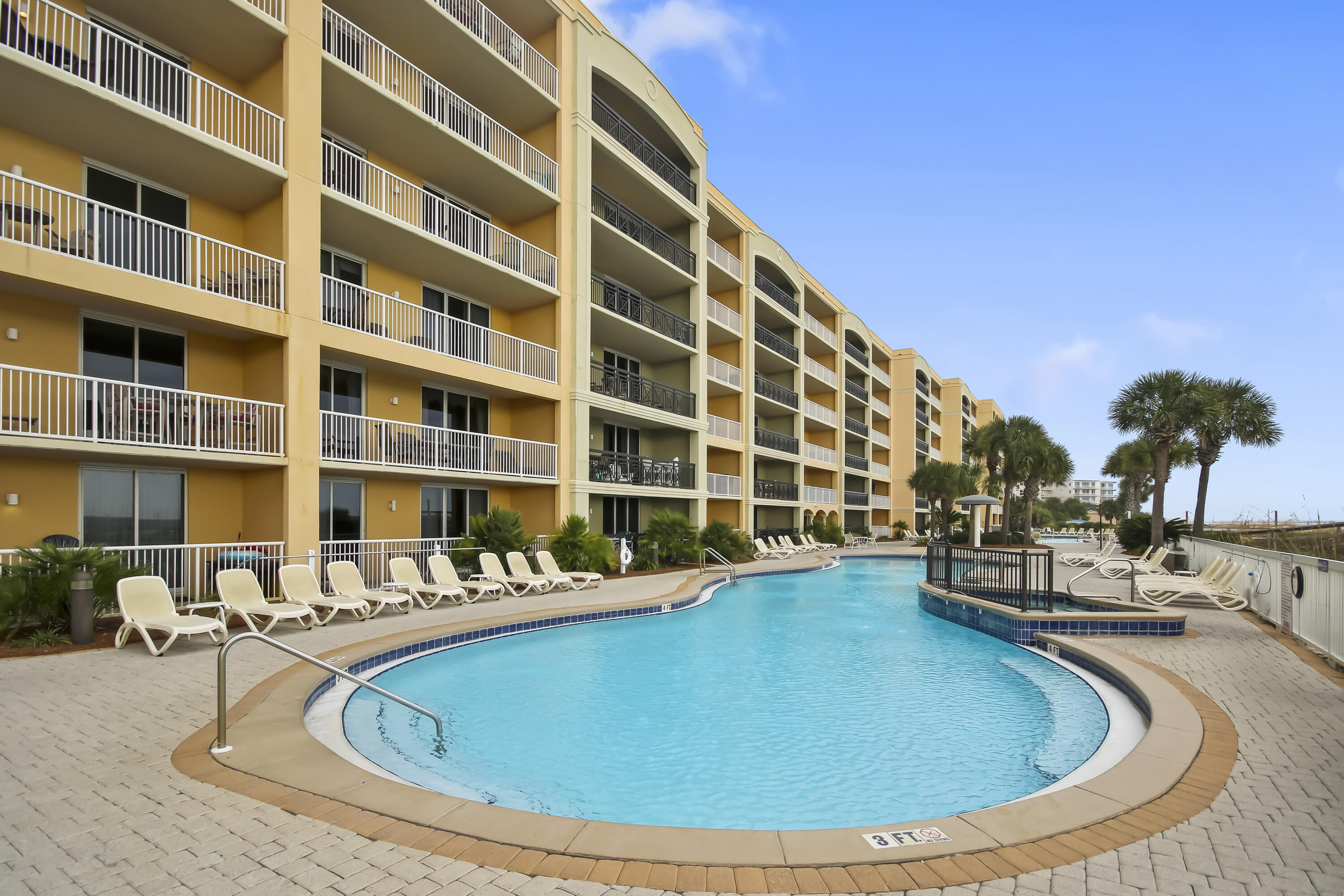 1150 Santa Rosa Boulevard, Unit 502 Fort Walton Beach, FL 32548 - Photo 28 of 43 a view of building with swimming pool and patio