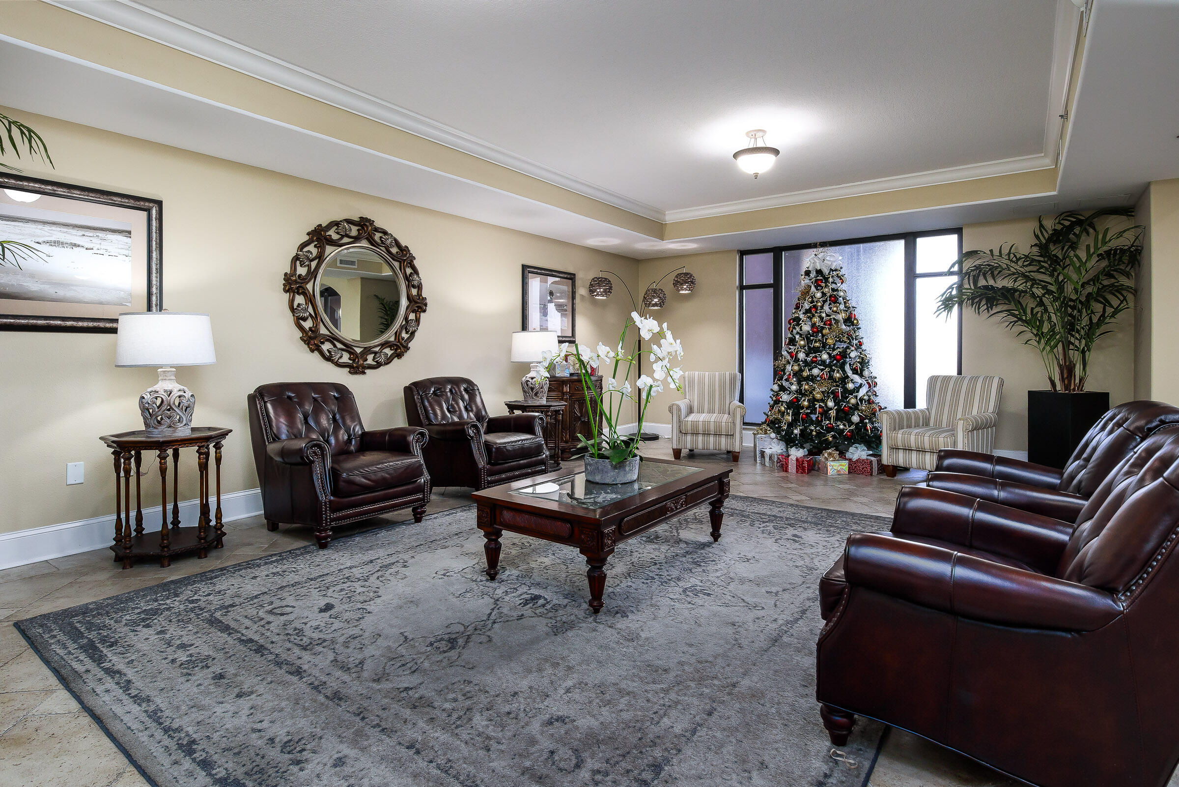 1150 Santa Rosa Boulevard, Unit 502 Fort Walton Beach, FL 32548 - Photo 35 of 43 a living room with furniture a table and a large window