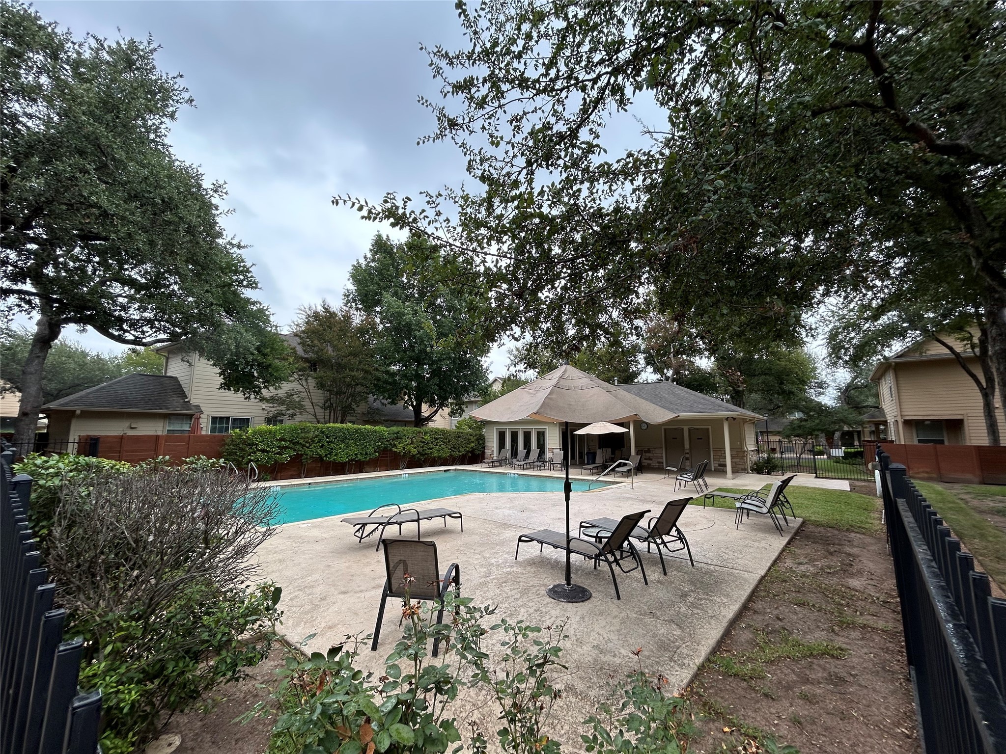 11000 Anderson Mill Road, Unit 34 Austin, TX 78750 - Photo 17 of 18 an outdoor space with patio and white umbrellas