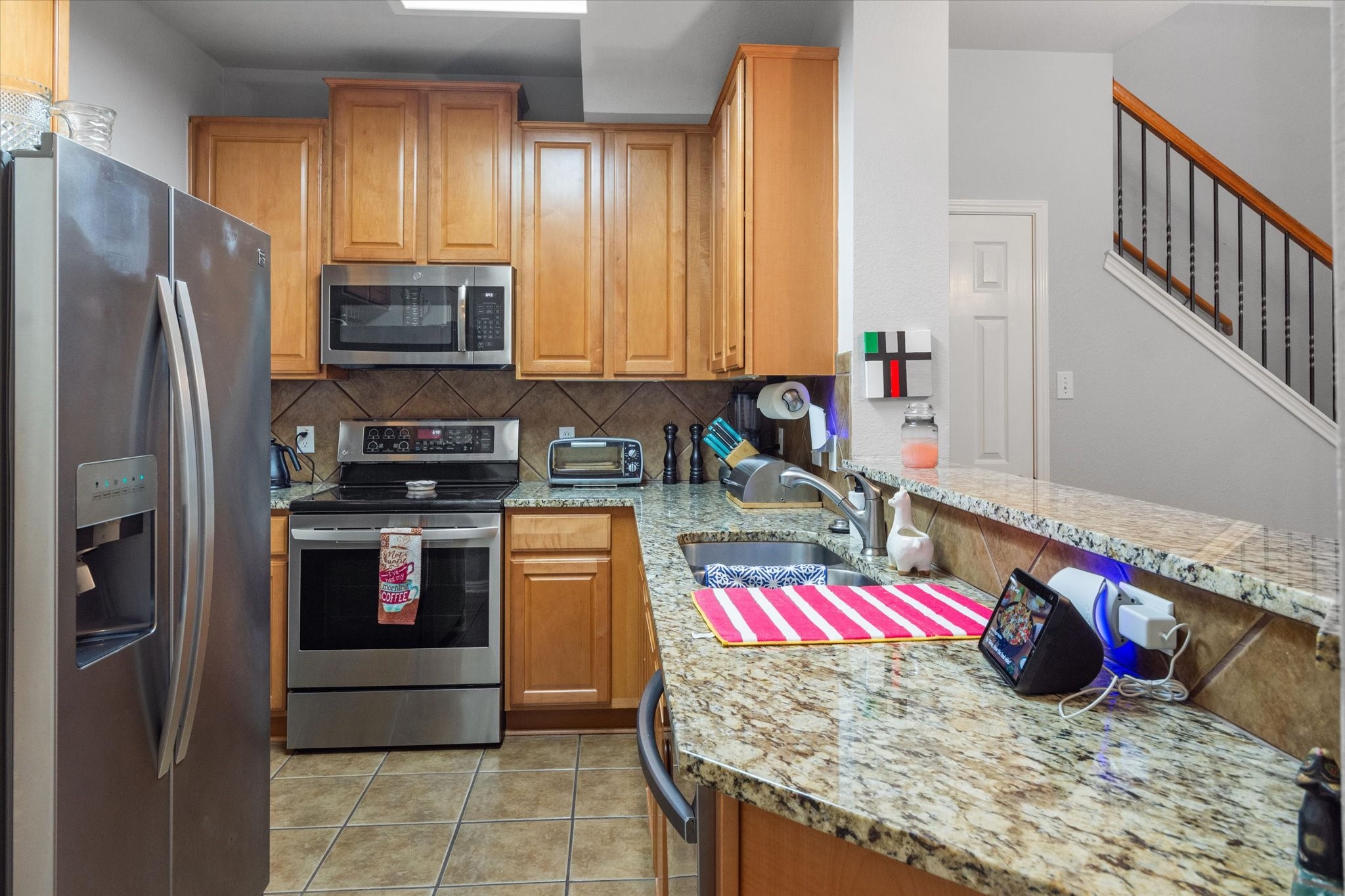 11000 Anderson Mill Road, Unit 34 Austin, TX 78750 - Photo 3 of 18 a kitchen with stainless steel appliances granite countertop a sink stove and refrigerator
