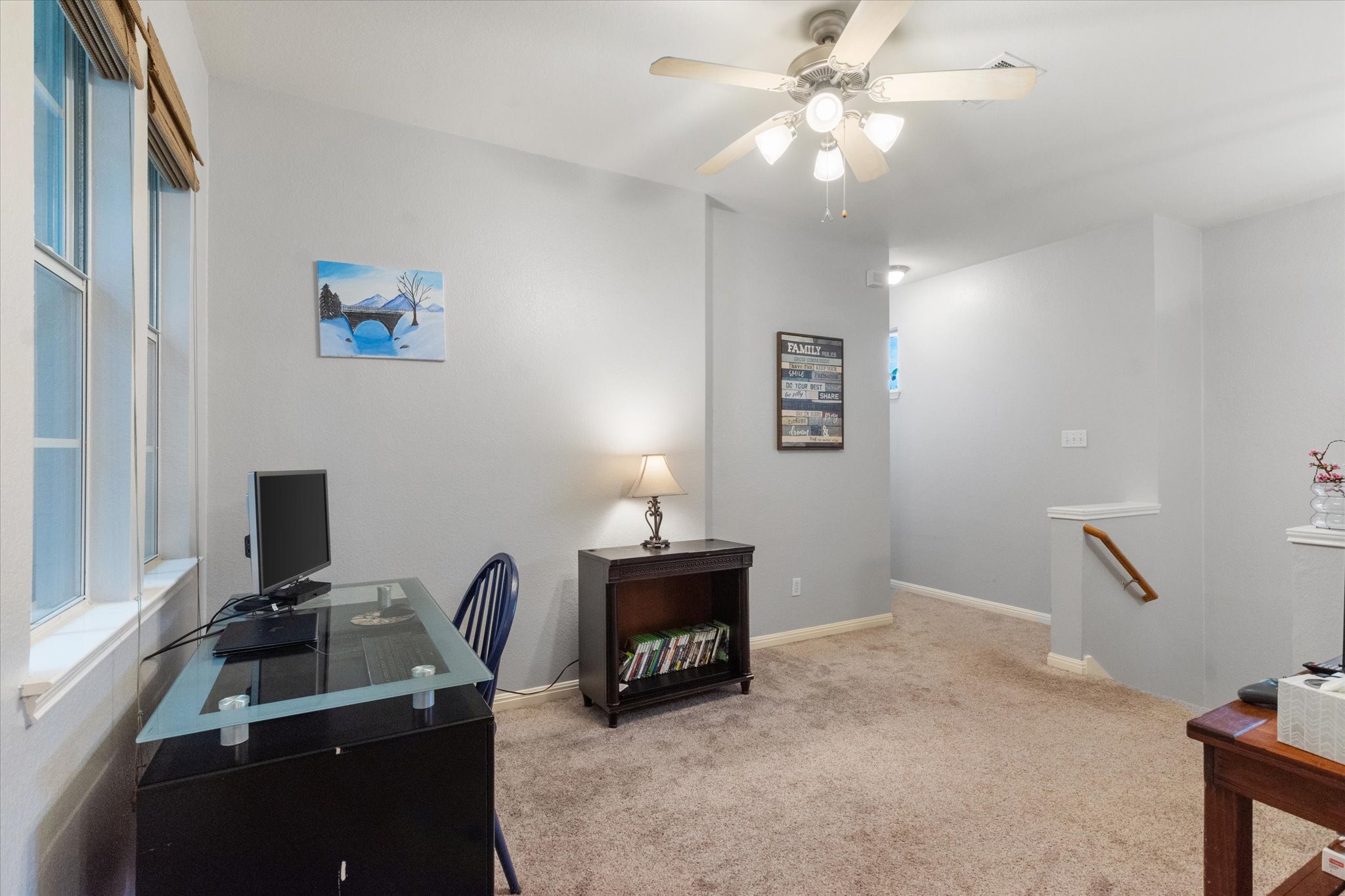 11000 Anderson Mill Road, Unit 34 Austin, TX 78750 - Photo 8 of 18 a room with furniture and a chandelier fan
