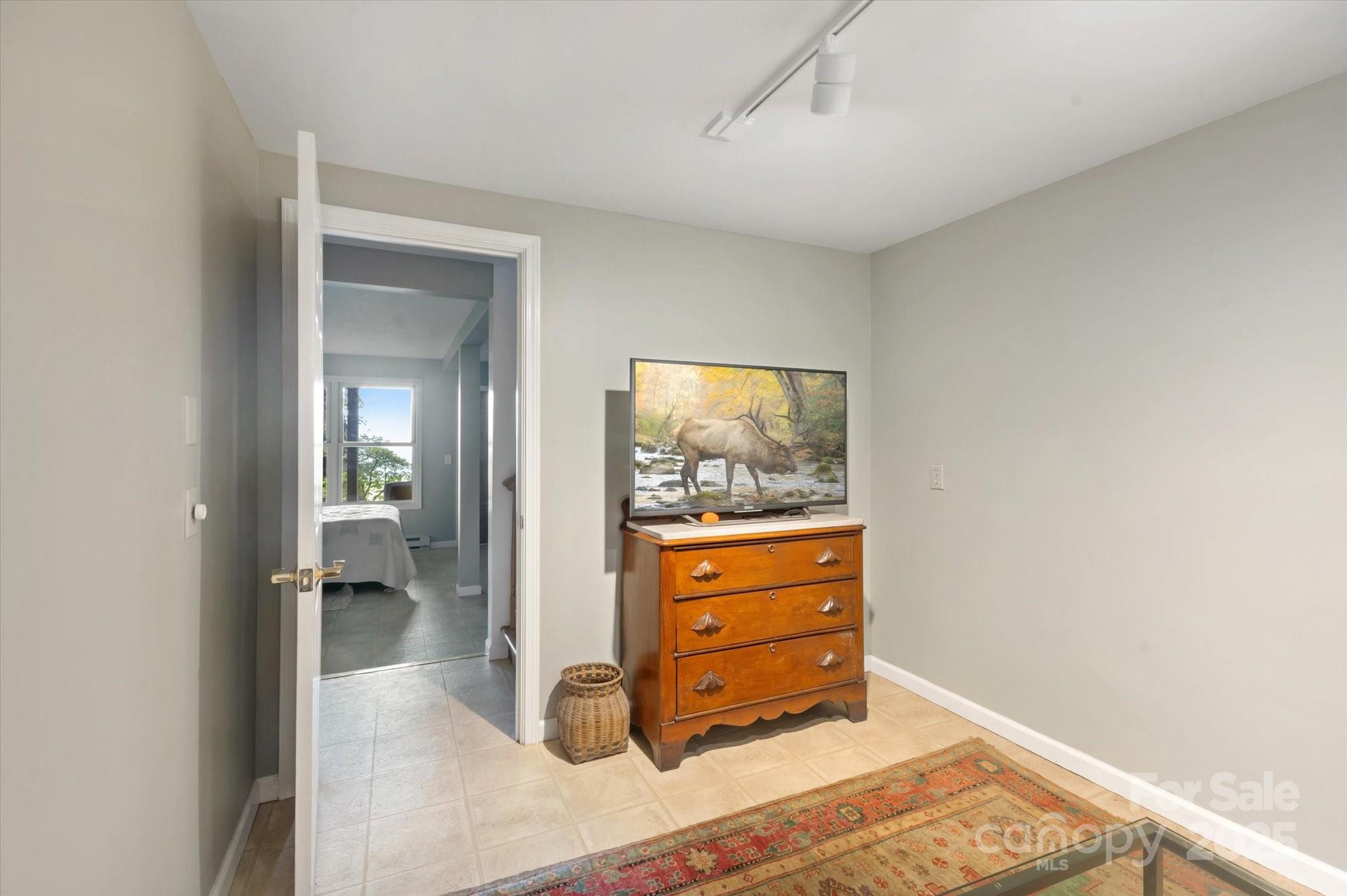 909 Green Hill Road Brevard, NC 28712 - Photo 22 of 44 view of room with wooden floor