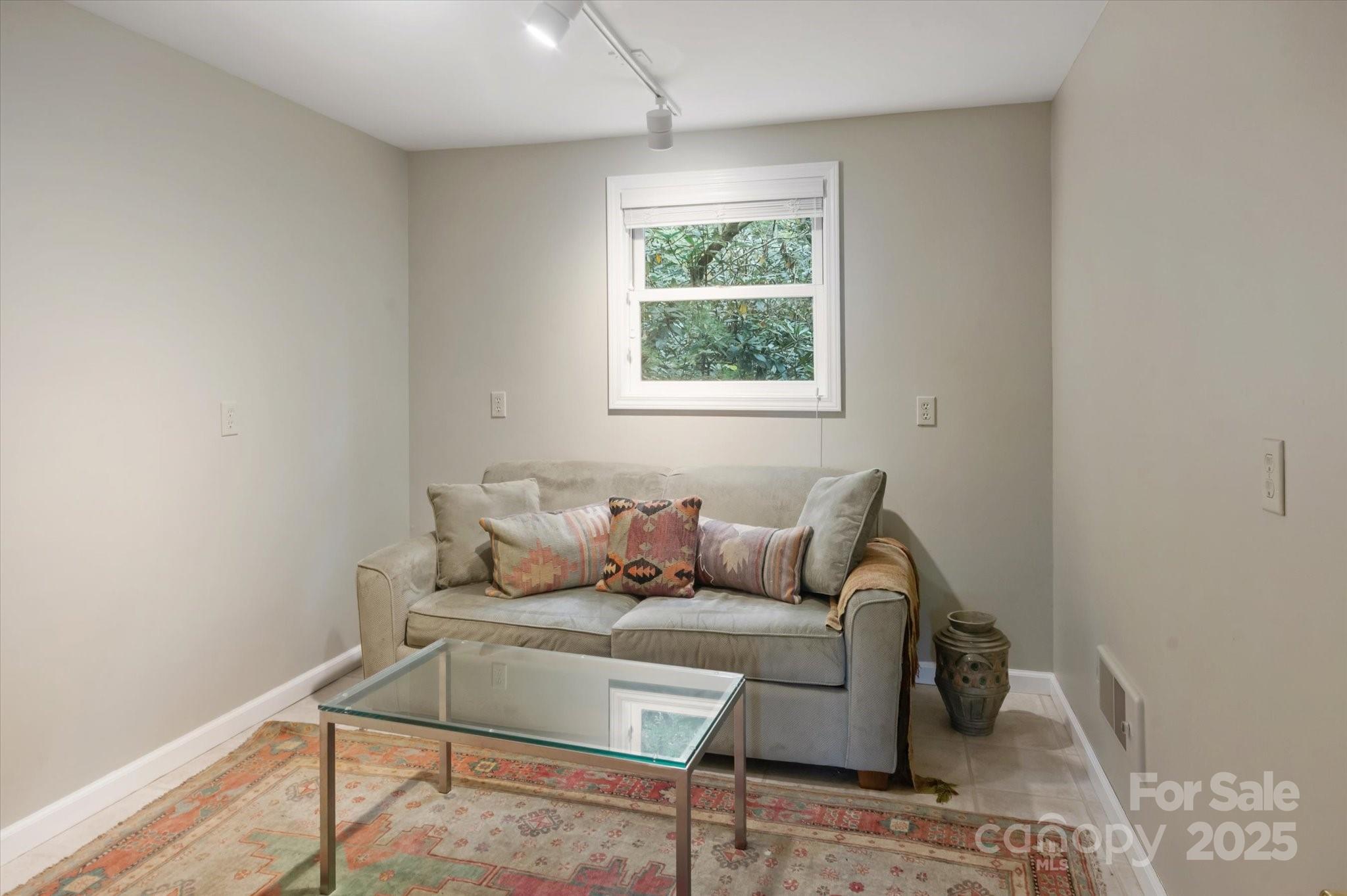 909 Green Hill Road Brevard, NC 28712 - Photo 25 of 44 a living room with furniture and a window