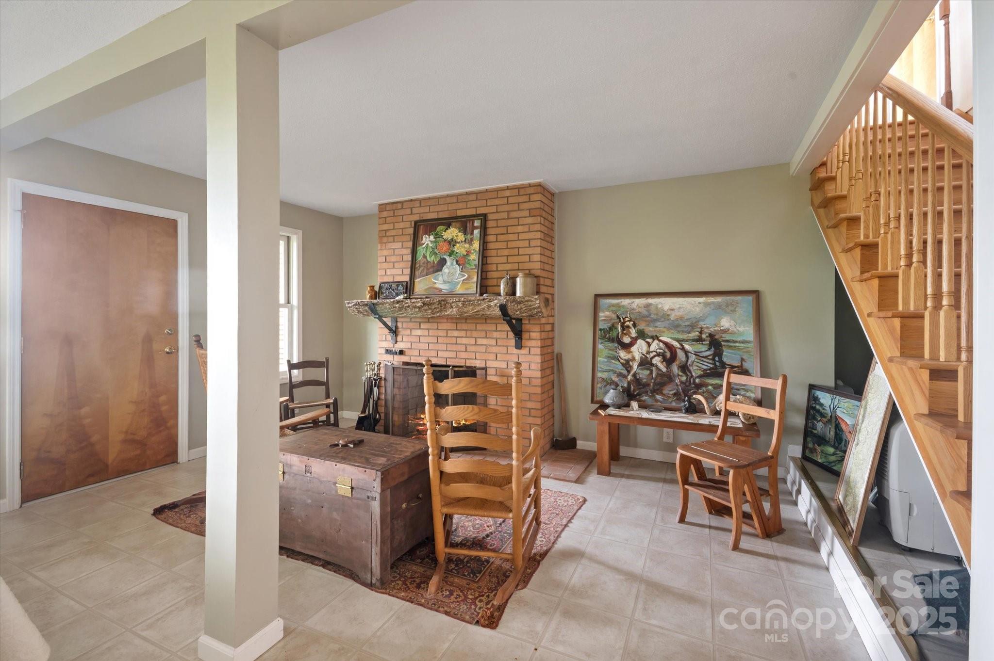 909 Green Hill Road Brevard, NC 28712 - Photo 26 of 44 a living room with furniture a rug and a window
