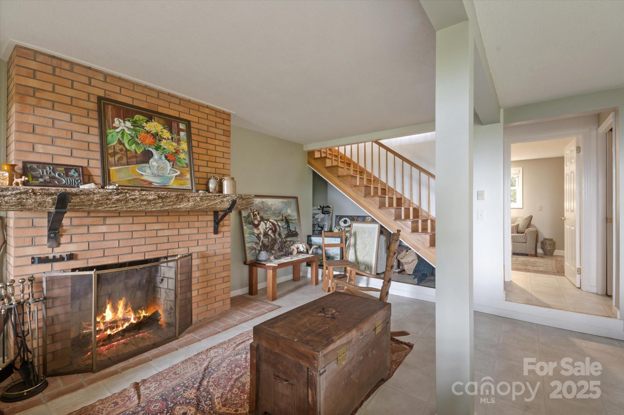 909 Green Hill Road Brevard, NC 28712 - Photo 27 of 44 a living room with furniture and a fireplace