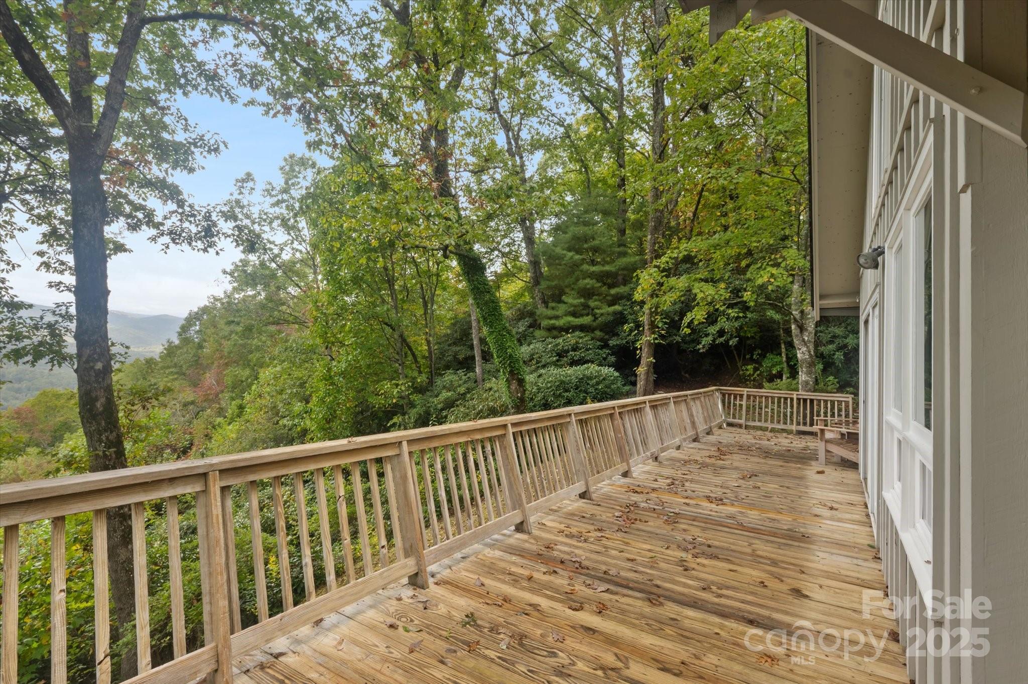 909 Green Hill Road Brevard, NC 28712 - Photo 4 of 44 a view of balcony with wooden floor and fence