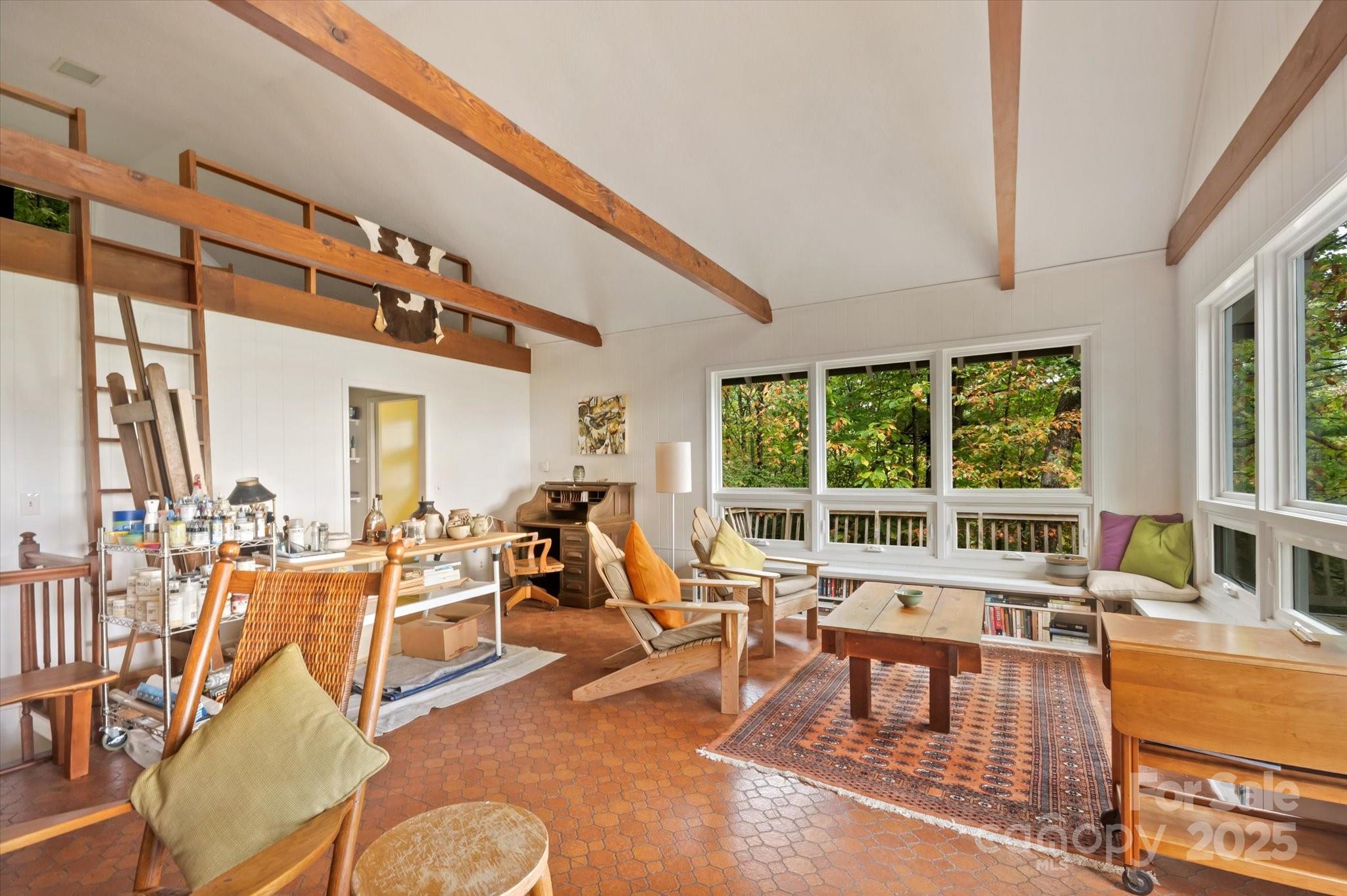 909 Green Hill Road Brevard, NC 28712 - Photo 9 of 44 a living room with furniture and a large window