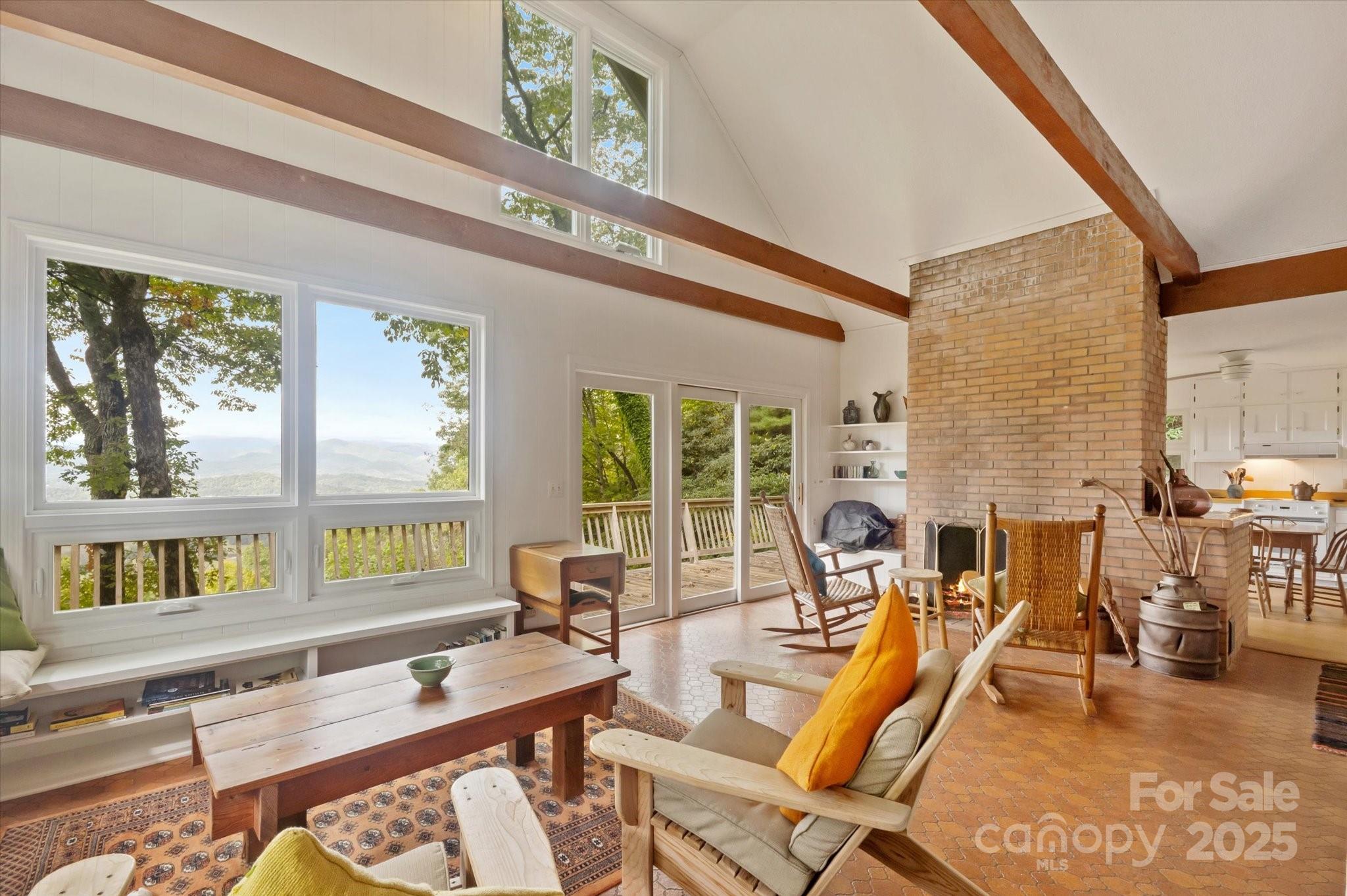 909 Green Hill Road Brevard, NC 28712 - Photo 10 of 44 a living room with furniture and a large window