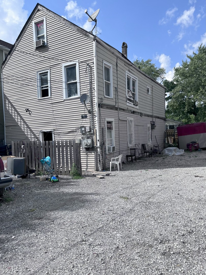 2103 West 52nd Street Chicago, IL 60609 - Photo 2 of 9 a front view of a house with a yard
