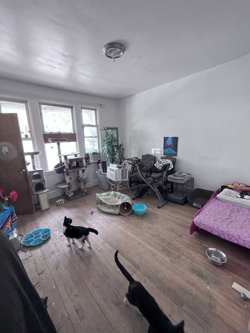2103 West 52nd Street Chicago, IL 60609 - Photo 5 of 9 a living room with furniture and a wooden floor