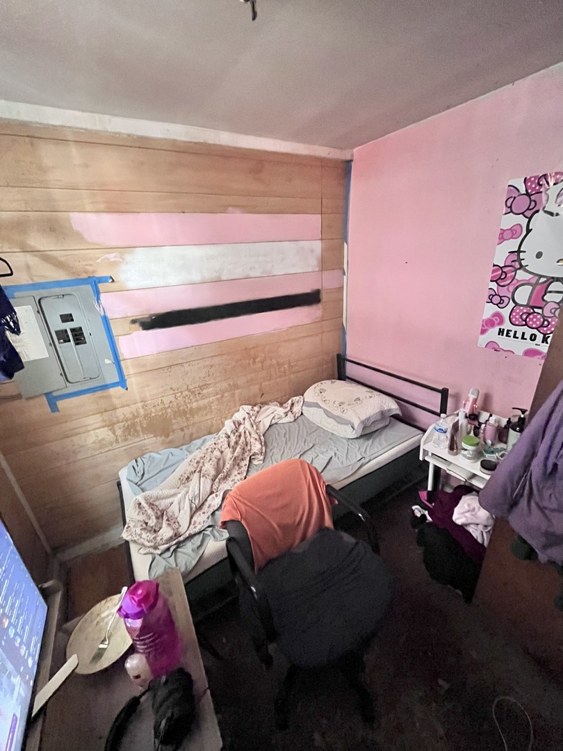 2103 West 52nd Street Chicago, IL 60609 - Photo 7 of 9 a bedroom with a bed and a couch