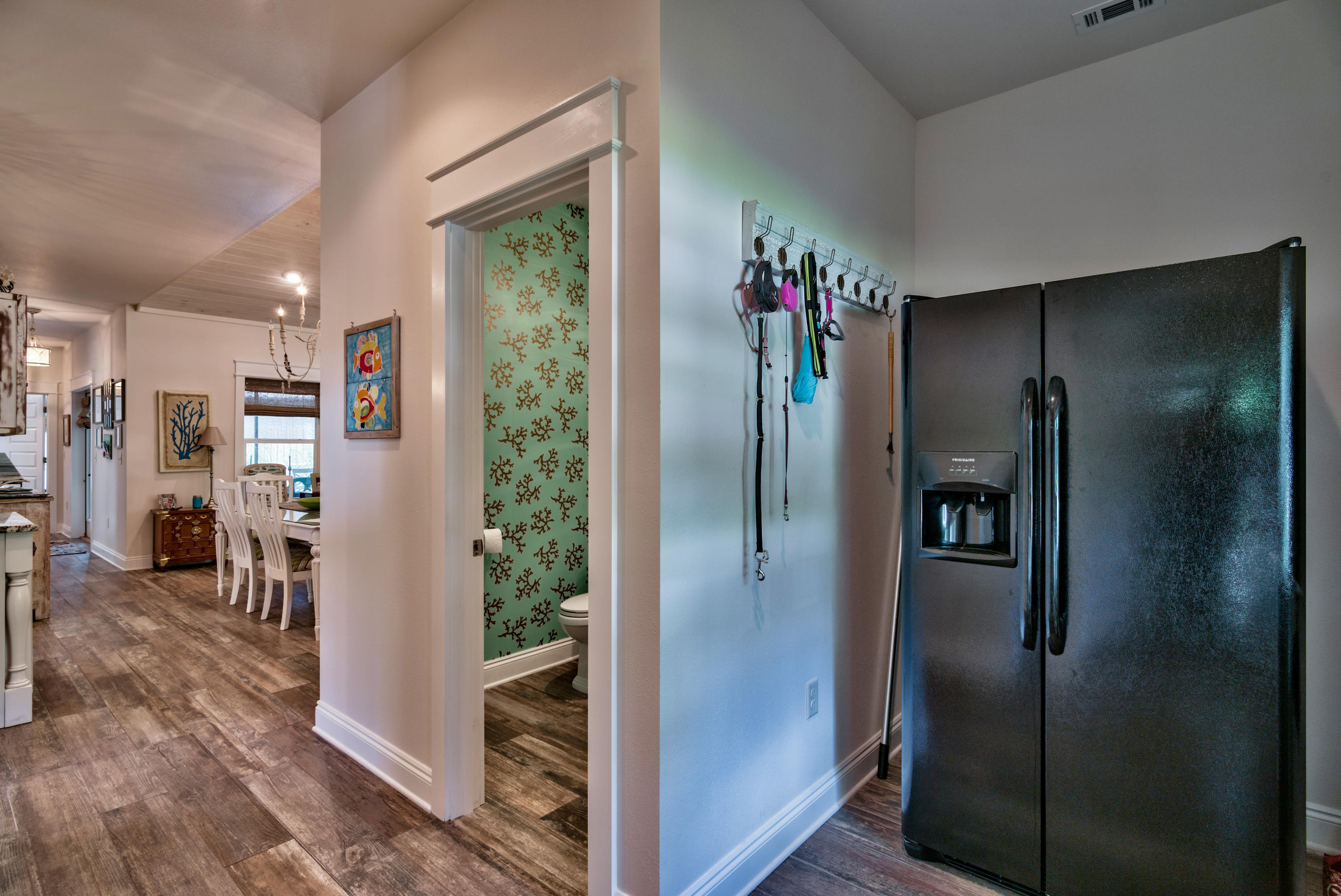 170 Sunrise Circle Santa Rosa Beach, FL 32459 - Photo 11 of 37 a view of a refrigerator in kitchen and dining room