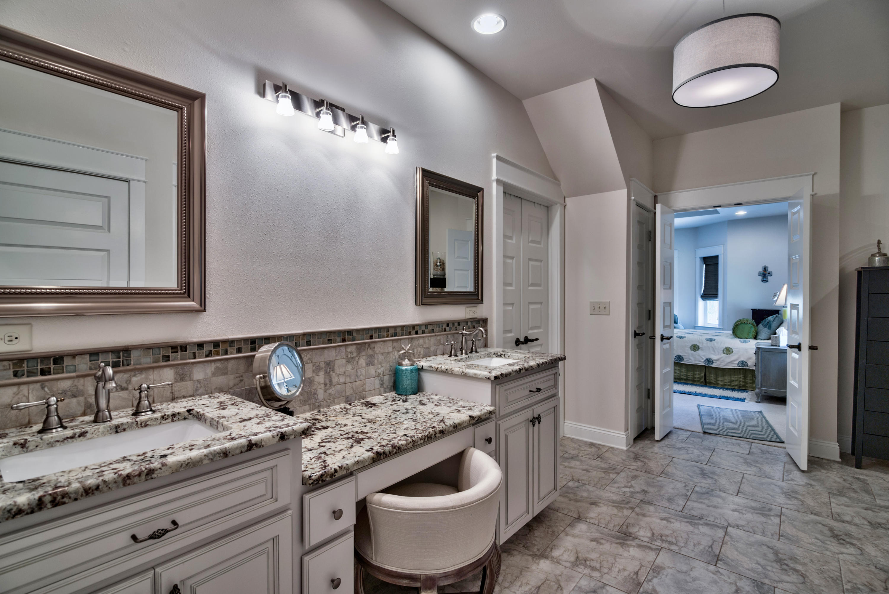 170 Sunrise Circle Santa Rosa Beach, FL 32459 - Photo 18 of 37 a bathroom with a granite countertop sink and a mirror