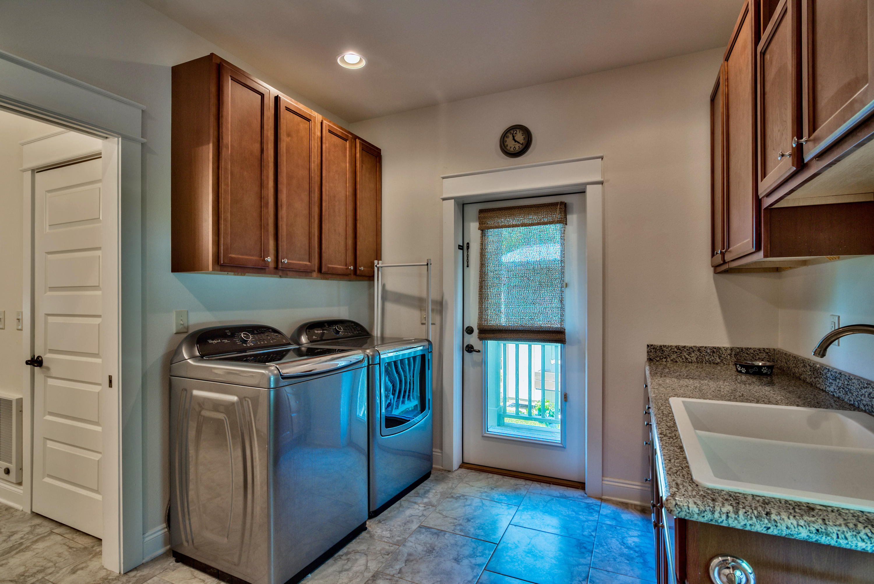 170 Sunrise Circle Santa Rosa Beach, FL 32459 - Photo 19 of 37 a kitchen with granite countertop cabinets washer and dryer
