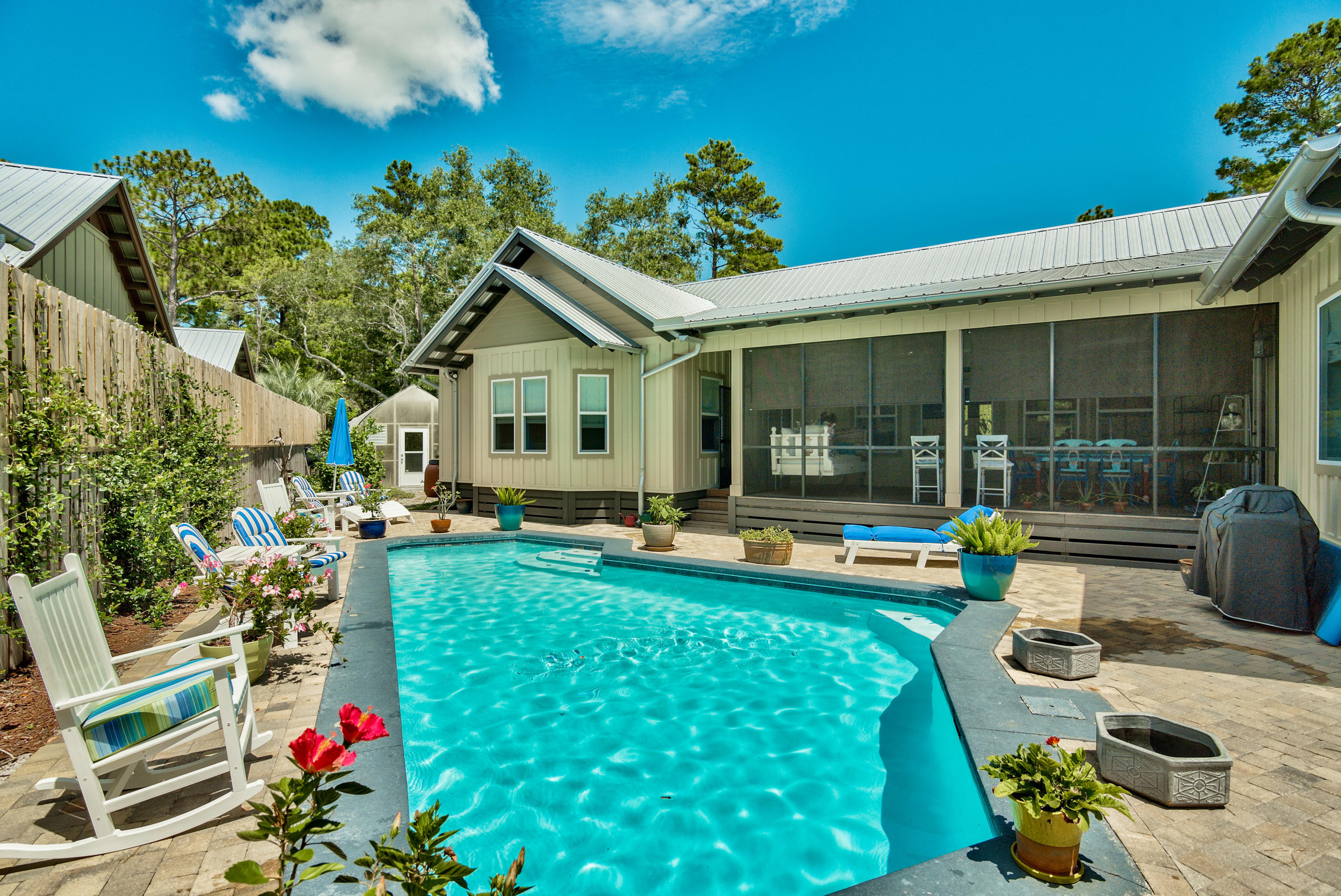 170 Sunrise Circle Santa Rosa Beach, FL 32459 - Photo 29 of 37 a view of a house with swimming pool and porch