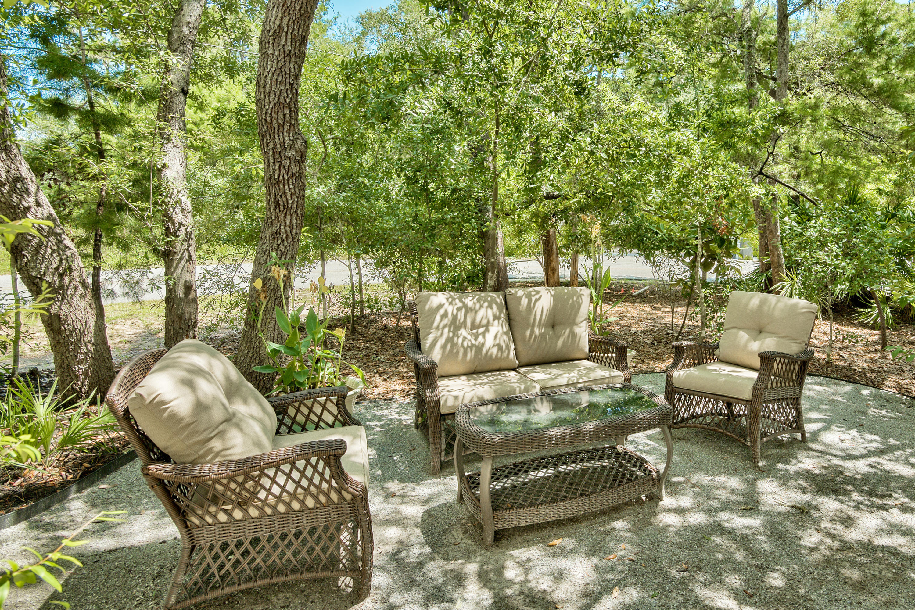 170 Sunrise Circle Santa Rosa Beach, FL 32459 - Photo 35 of 37 a terrace with outdoor seating and trees