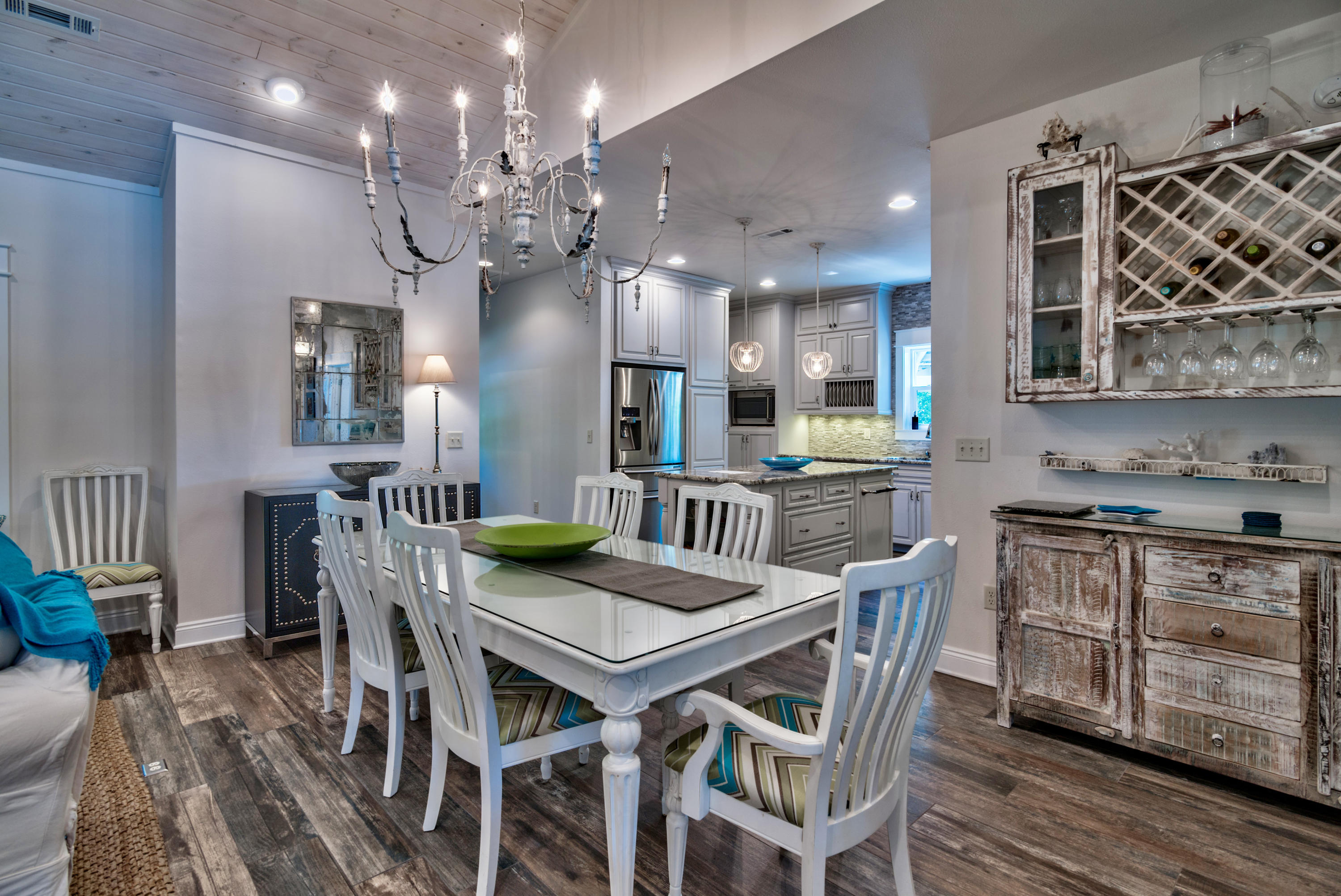 170 Sunrise Circle Santa Rosa Beach, FL 32459 - Photo 6 of 37 a view of a dining room with furniture wooden floor and chandelier