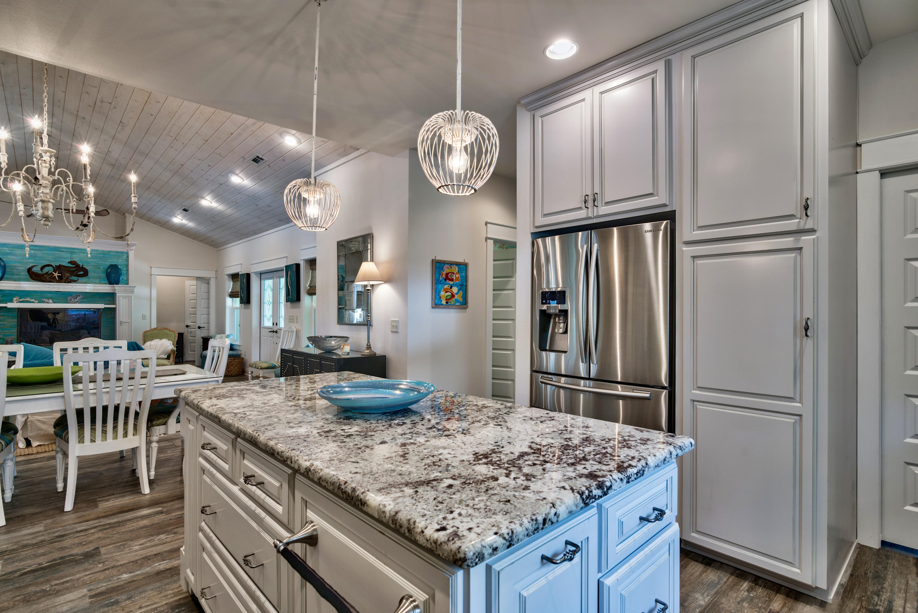 170 Sunrise Circle Santa Rosa Beach, FL 32459 - Photo 10 of 37 a kitchen with granite countertop a table chairs and refrigerator